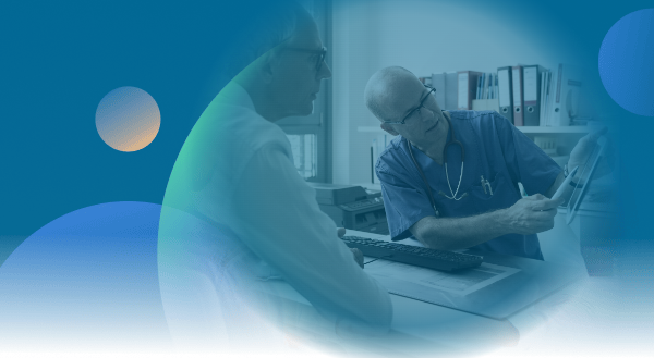 Doctor showing another doctor an ipad.